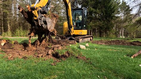 mini excavator removing stumps|pulling out stumps with excavator.